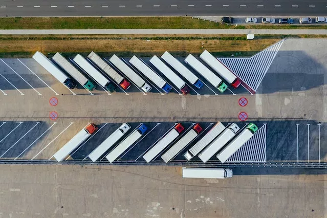 Photo by Marcin Jozwiak: https://www.pexels.com/photo/aerial-photography-of-trucks-parked-2800121/
